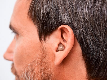 man wearing hearing aid ear