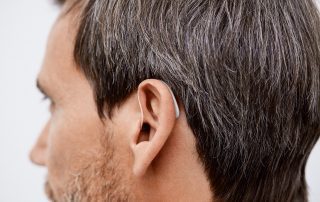 man wearing hearing aid ear