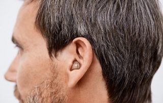 man wearing hearing aid ear